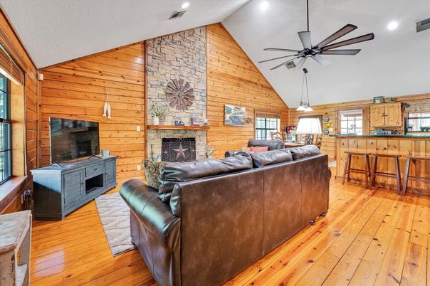 Fireplace, Interior, Living room, Pendant Lights, Recessed Lighting, Stone Walls, Wood Texture Flooring, Wooden Walls