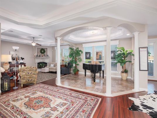 Fireplace, Interior, Living room, Piano, Recessed Lighting, Wood Texture Flooring