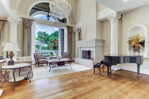 Chandelier, Fireplace, Interior, Living room, Piano, Recessed Lighting, Wood Texture Flooring