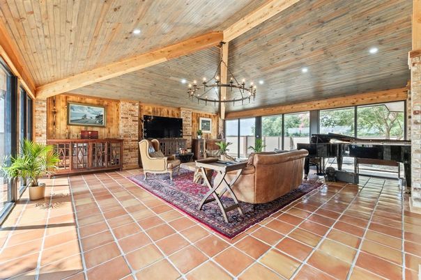 Chandelier, Fireplace, Interior, Living room, Piano, Recessed Lighting, Stone Walls, Wooden Beams, Wooden Ceilings