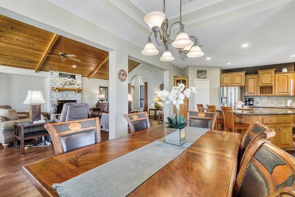 Dining room, Fireplace, Interior, Kitchen, Living room, Pendant Lights, Recessed Lighting, Stainless Steel Appliances, Stone Walls, Wooden Beams, Wooden Ceilings, Wood Texture Flooring