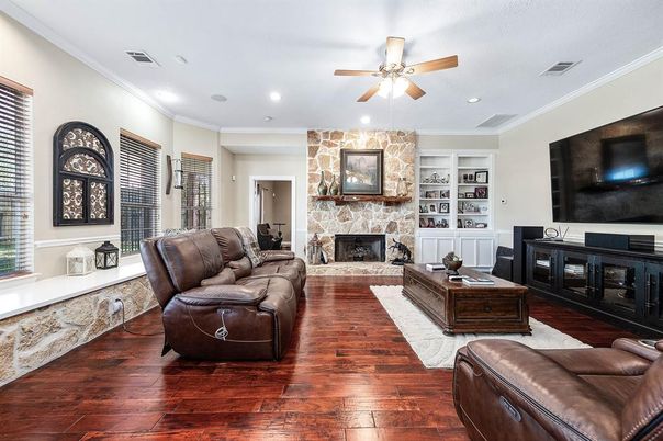 Fireplace, Interior, Living room, Recessed Lighting, Stone Walls, Wood Texture Flooring
