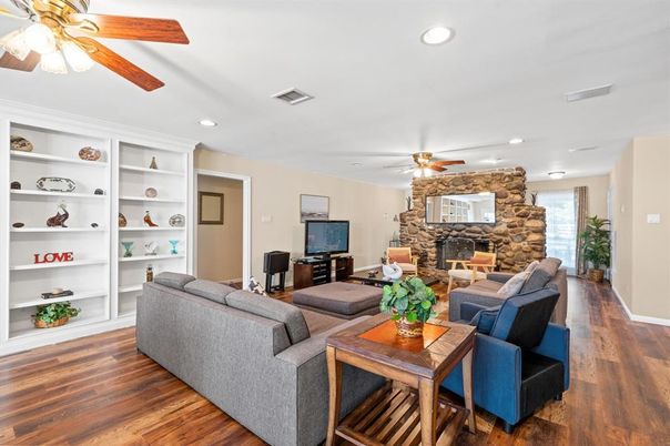 Fireplace, Interior, Living room, Recessed Lighting, Stone Walls, Wood Texture Flooring