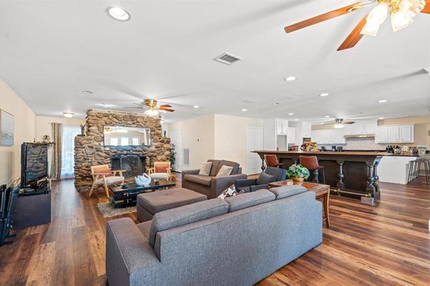Fireplace, Interior, Kitchen, Living room, Recessed Lighting, Stone Walls, Wood Texture Flooring