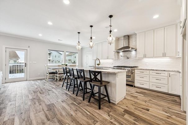 Dining room, Interior, Kitchen, Pendant Lights, Recessed Lighting, Stainless Steel Appliances, Wood Texture Flooring