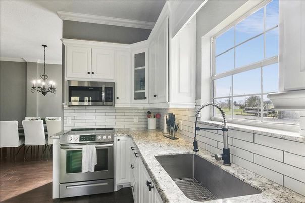 Chandelier, Dining room, Interior, Kitchen, Pendant Lights, Stainless Steel Appliances, Wood Texture Flooring