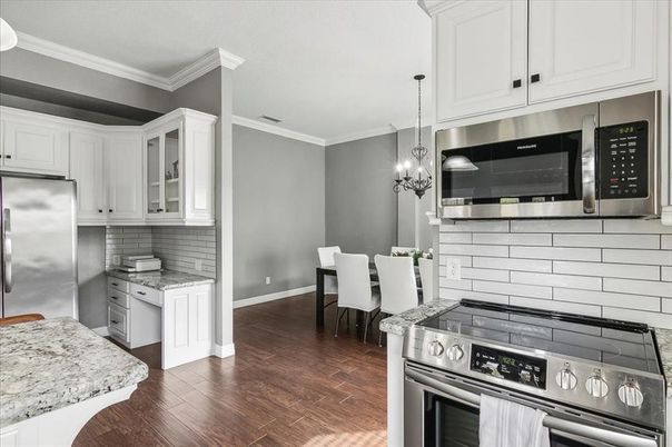 Chandelier, Dining room, Interior, Kitchen, Pendant Lights, Stainless Steel Appliances, Wood Texture Flooring