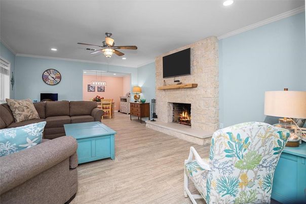 Fireplace, Interior, Living room, Recessed Lighting, Stone Walls, Wood Texture Flooring