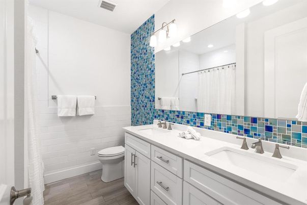 Bathroom, Dual Sink Vanities, Interior, Recessed Lighting, Wood Texture Flooring
