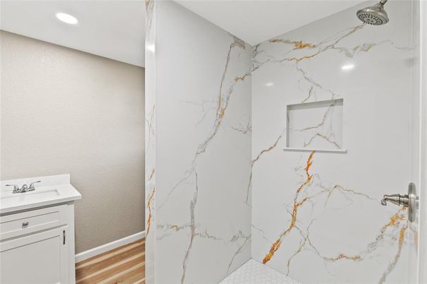 Bathroom, Interior, Marble Walls, Recessed Lighting, Wood Texture Flooring
