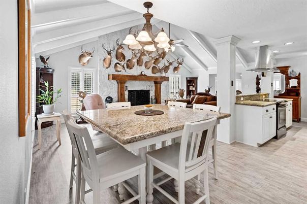 Chandelier, Dining room, Fireplace, Interior, Kitchen, Recessed Lighting, Stainless Steel Appliances, Wood Texture Flooring