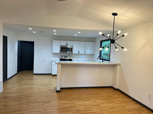 Interior, Kitchen, Pendant Lights, Recessed Lighting, Stainless Steel Appliances, Wood Texture Flooring
