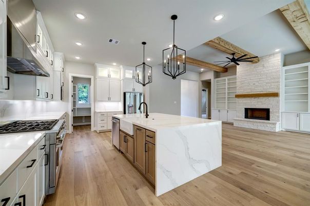 Fireplace, Interior, Kitchen, Pendant Lights, Recessed Lighting, Stainless Steel Appliances, Stone Walls, Wooden Beams, Wood Texture Flooring