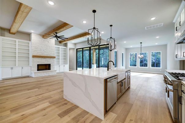 Fireplace, Interior, Kitchen, Pendant Lights, Recessed Lighting, Stainless Steel Appliances, Stone Walls, Wooden Beams, Wood Texture Flooring