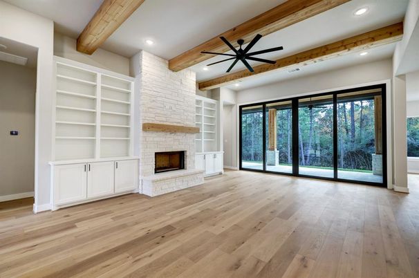 Empty room, Fireplace, Interior, Recessed Lighting, Stone Walls, Wooden Beams, Wood Texture Flooring