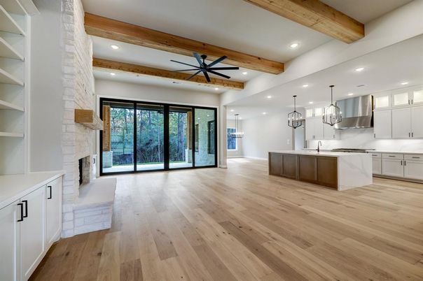 Fireplace, Interior, Kitchen, Pendant Lights, Recessed Lighting, Stainless Steel Appliances, Stone Walls, Wooden Beams, Wood Texture Flooring