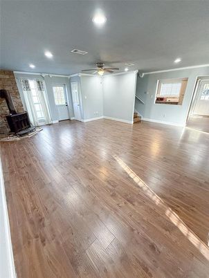 Empty room, Fireplace, Interior, Recessed Lighting, Stone Walls, Wood Texture Flooring