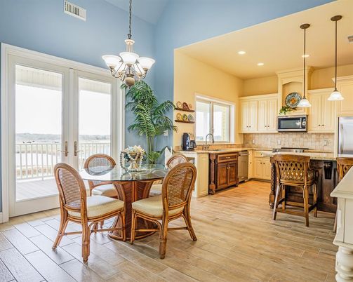 Chandelier, Dining room, Interior, Kitchen, Pendant Lights, Recessed Lighting, Stainless Steel Appliances, Wood Texture Flooring