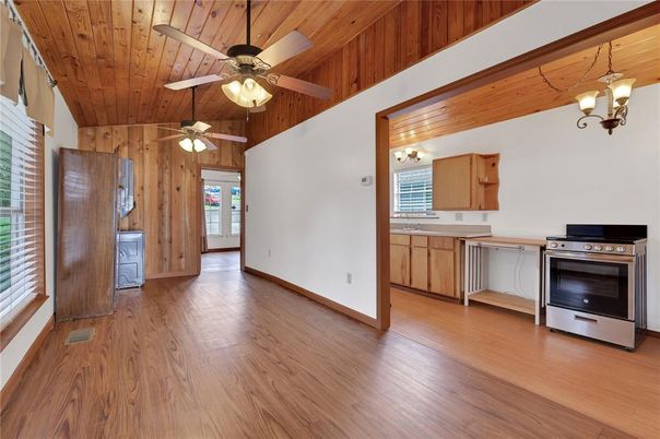 Empty room, Interior, Kitchen, Stainless Steel Appliances, Wooden Ceilings, Wood Texture Flooring