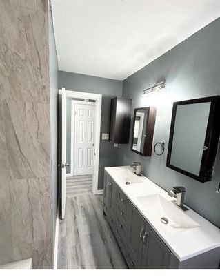 Bathroom, Dual Sink Vanities, Interior, Marble Walls, Wood Texture Flooring