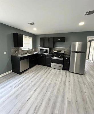Interior, Kitchen, Recessed Lighting, Stainless Steel Appliances, Wood Texture Flooring