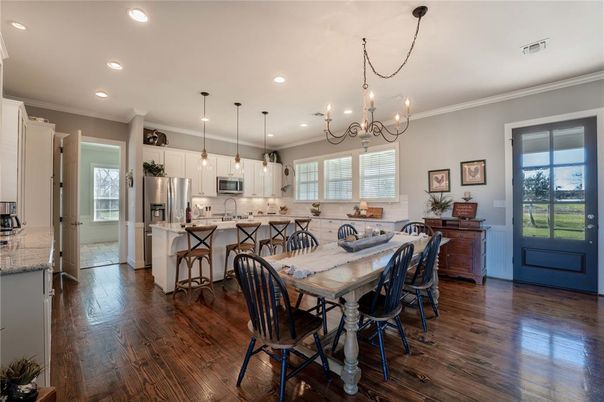 Chandelier, Dining room, Interior, Kitchen, Pendant Lights, Recessed Lighting, Stainless Steel Appliances, Wood Texture Flooring