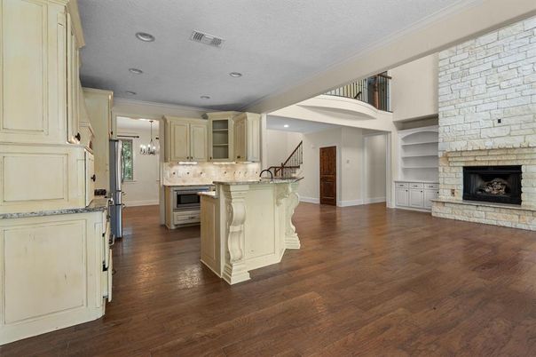 Chandelier, Fireplace, Interior, Kitchen, Pendant Lights, Recessed Lighting, Stone Walls, Wood Texture Flooring