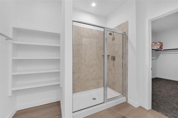 Bathroom, Glass Shower, Interior, Recessed Lighting, Walk-in Closets, Wood Texture Flooring