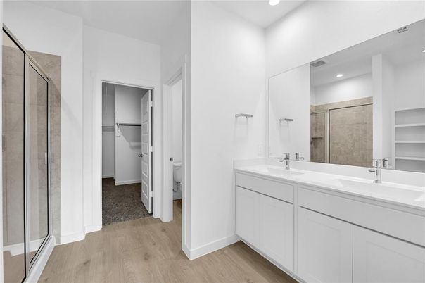 Bathroom, Dual Sink Vanities, Glass Shower, Interior, Recessed Lighting, Wood Texture Flooring