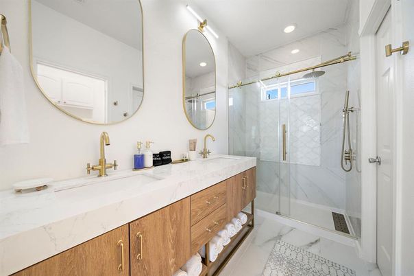 Bathroom, Dual Sink Vanities, Glass Shower, Interior, Marble, Marble Walls, Recessed Lighting