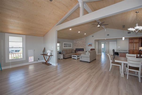 Dining room, Fireplace, Interior, Living room, Pendant Lights, Recessed Lighting, Stone Walls, Wooden Ceilings, Wood Texture Flooring