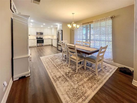 Chandelier, Dining room, Interior, Kitchen, Recessed Lighting, Stainless Steel Appliances, Wood Texture Flooring