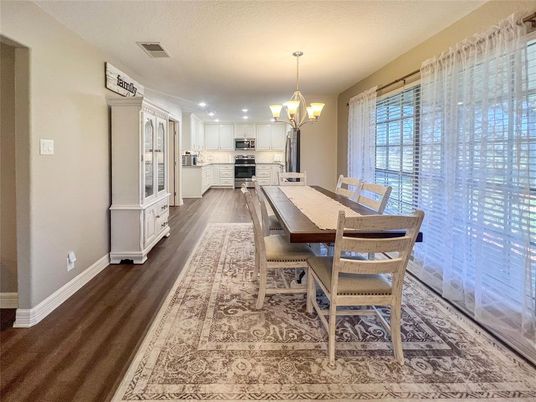 Chandelier, Dining room, Interior, Kitchen, Recessed Lighting, Stainless Steel Appliances, Wood Texture Flooring