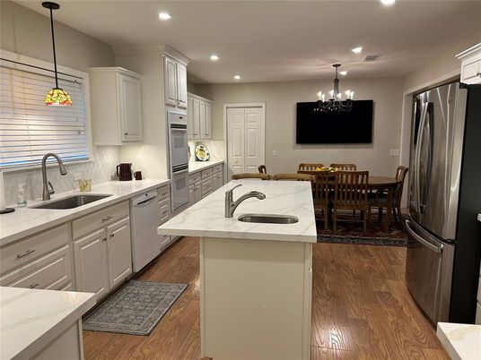 Chandelier, Dining room, Interior, Kitchen, Pendant Lights, Recessed Lighting, Stainless Steel Appliances, Wood Texture Flooring