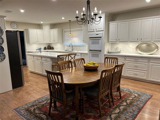 Chandelier, Dining room, Interior, Kitchen, Pendant Lights, Recessed Lighting, Stainless Steel Appliances, Wood Texture Flooring