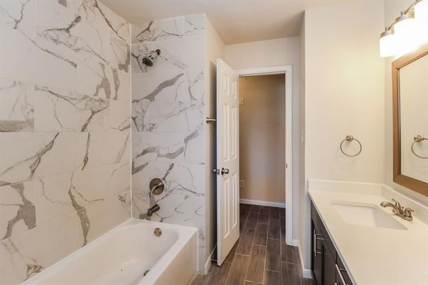 Bathroom, Dual Sink Vanities, Interior, Marble Walls, Wood Texture Flooring