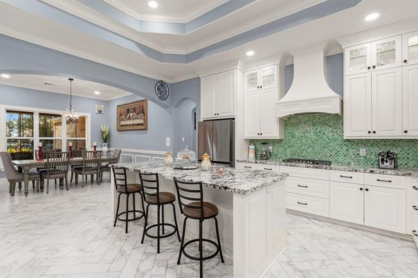 Chandelier, Dining room, Interior, Kitchen, Marble, Pendant Lights, Recessed Lighting, Stainless Steel Appliances