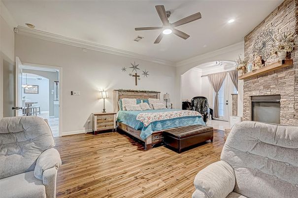 Bedroom, Fireplace, Interior, Recessed Lighting, Stone Walls, Wood Texture Flooring