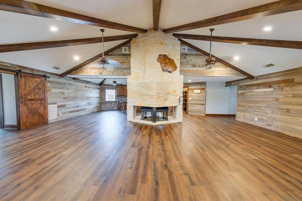 Empty room, Fireplace, Interior, Pendant Lights, Recessed Lighting, Stone Walls, Wooden Beams, Wood Texture Flooring, Wooden Walls