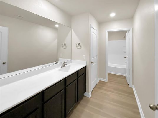 Bathroom, Dual Sink Vanities, Interior, Recessed Lighting, Wood Texture Flooring