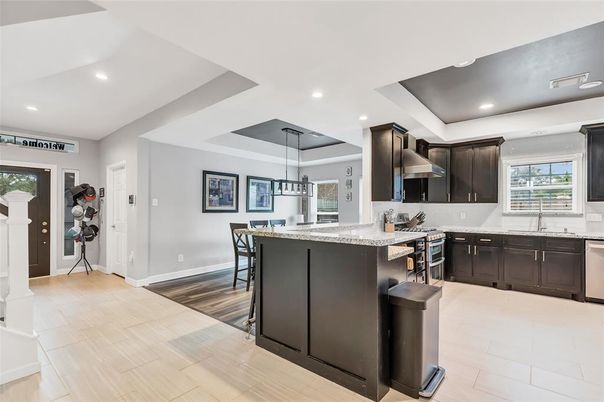 Dining room, Interior, Kitchen, Recessed Lighting, Stainless Steel Appliances, Wood Texture Flooring