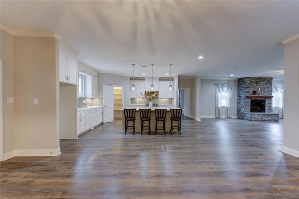 Fireplace, Interior, Kitchen, Pendant Lights, Recessed Lighting, Stone Walls, Wood Texture Flooring