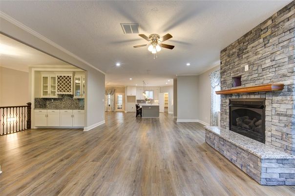 Empty room, Fireplace, Interior, Kitchen, Pendant Lights, Recessed Lighting, Stone Walls, Wood Texture Flooring