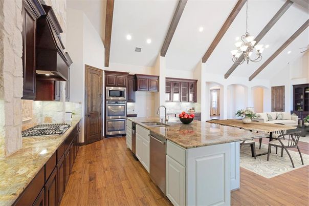 Chandelier, Dining room, Interior, Kitchen, Living room, Recessed Lighting, Stainless Steel Appliances, Wooden Beams, Wood Texture Flooring