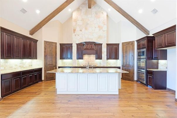 Fireplace, Interior, Kitchen, Recessed Lighting, Stainless Steel Appliances, Stone Walls, Wooden Beams, Wood Texture Flooring