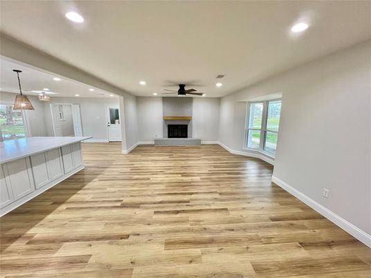 Empty room, Fireplace, Interior, Pendant Lights, Recessed Lighting, Wood Texture Flooring