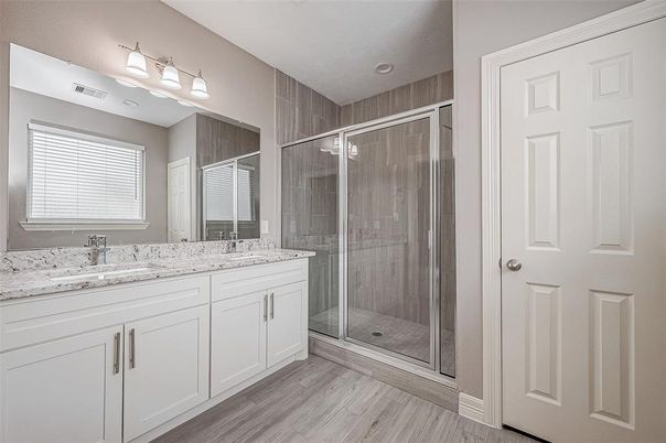 Bathroom, Dual Sink Vanities, Glass Shower, Interior, Recessed Lighting, Wood Texture Flooring