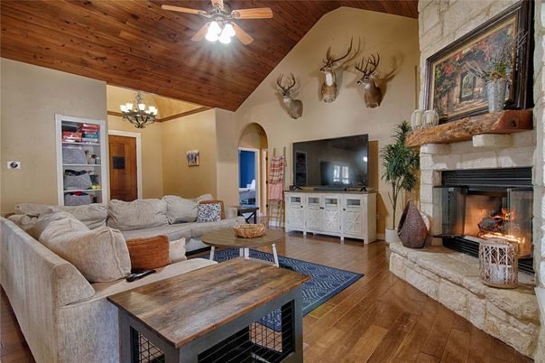 Chandelier, Fireplace, Interior, Living room, Stone Walls, Wooden Ceilings, Wood Texture Flooring