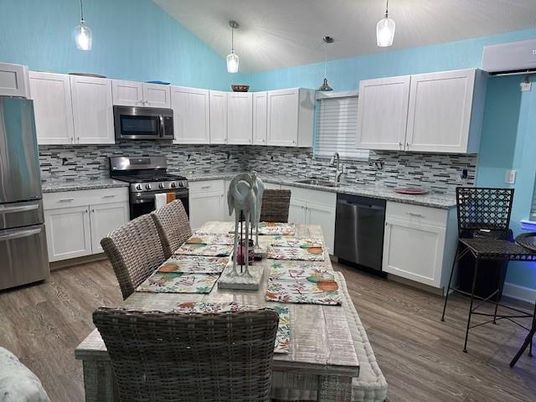 Dining room, Interior, Kitchen, Pendant Lights, Stainless Steel Appliances, Wood Texture Flooring