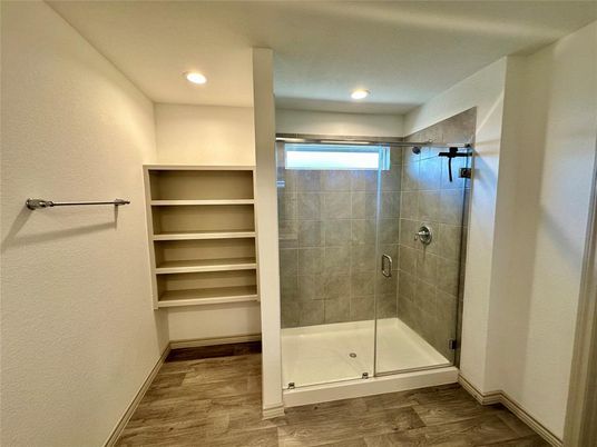 Bathroom, Glass Shower, Interior, Recessed Lighting, Walk-in Closets, Wood Texture Flooring